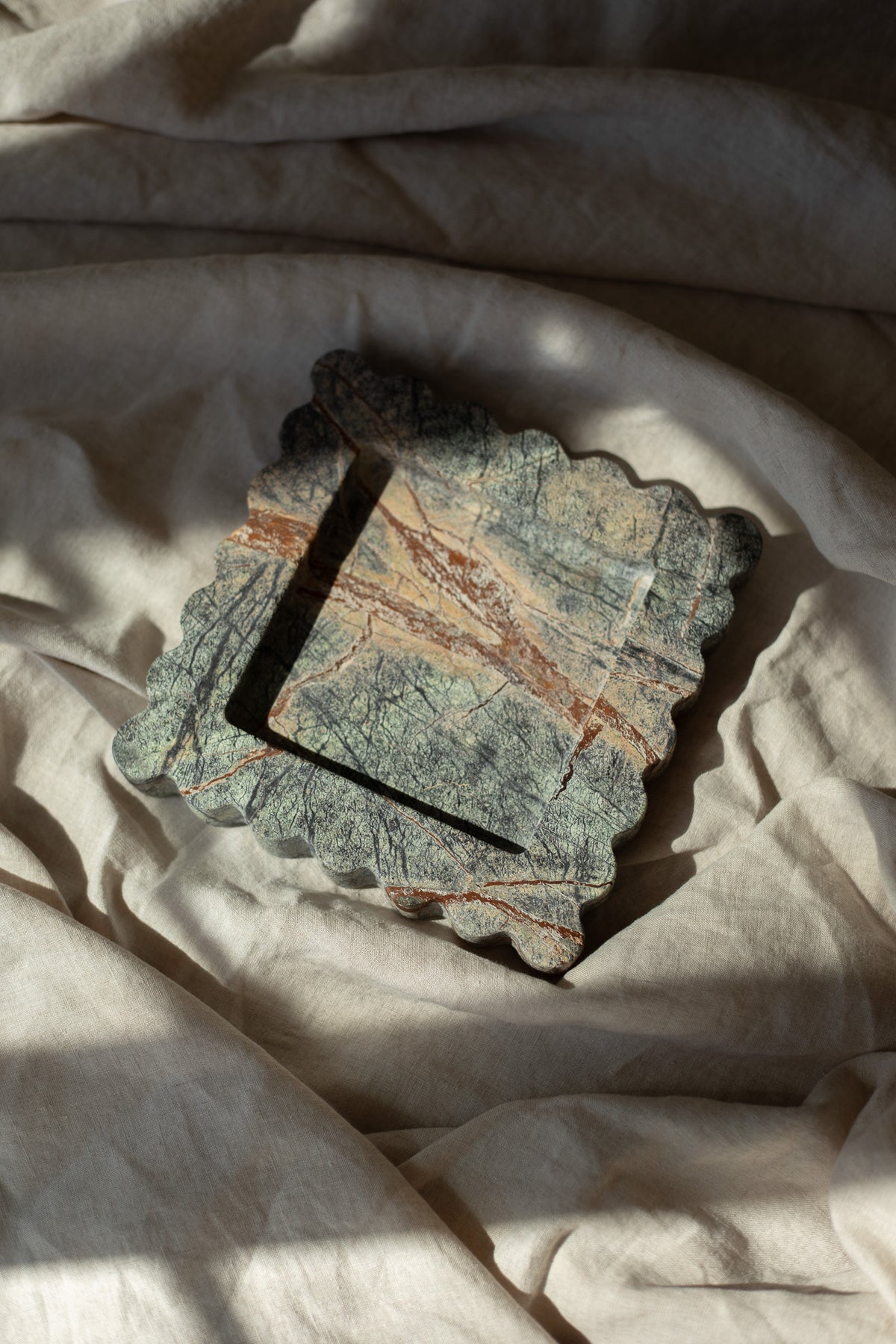 The Box Tray Seagrass by Anastasio Home, crafted from Indian Green Marble. This hand-finished, decorative tray features a unique seagrass color, ideal for organizing your coffee table or vanity.