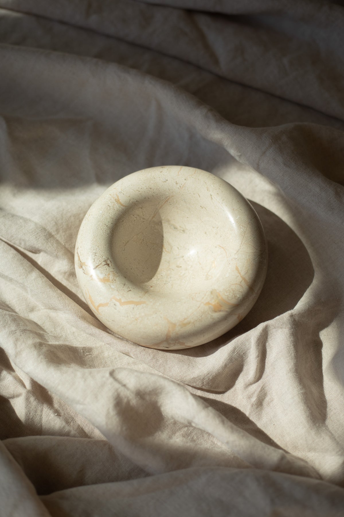 Set your keys, jewelry, and small treasures on a beautiful elegant bowl that provides organization and subtle sophitication to a coffee table, vanity, or nightstand. Crafted from marble and other precious materials, the Contour Bowl is a delicate home accessory that adds thoughtfulness to everyday items in your home.