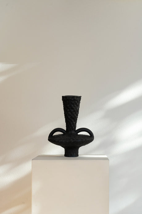 Hand-crafted Yves Sculpture Vessel, unglazed textured ceramic showcasing raw beauty of clay with an expressive design inspired by Yves Klein.