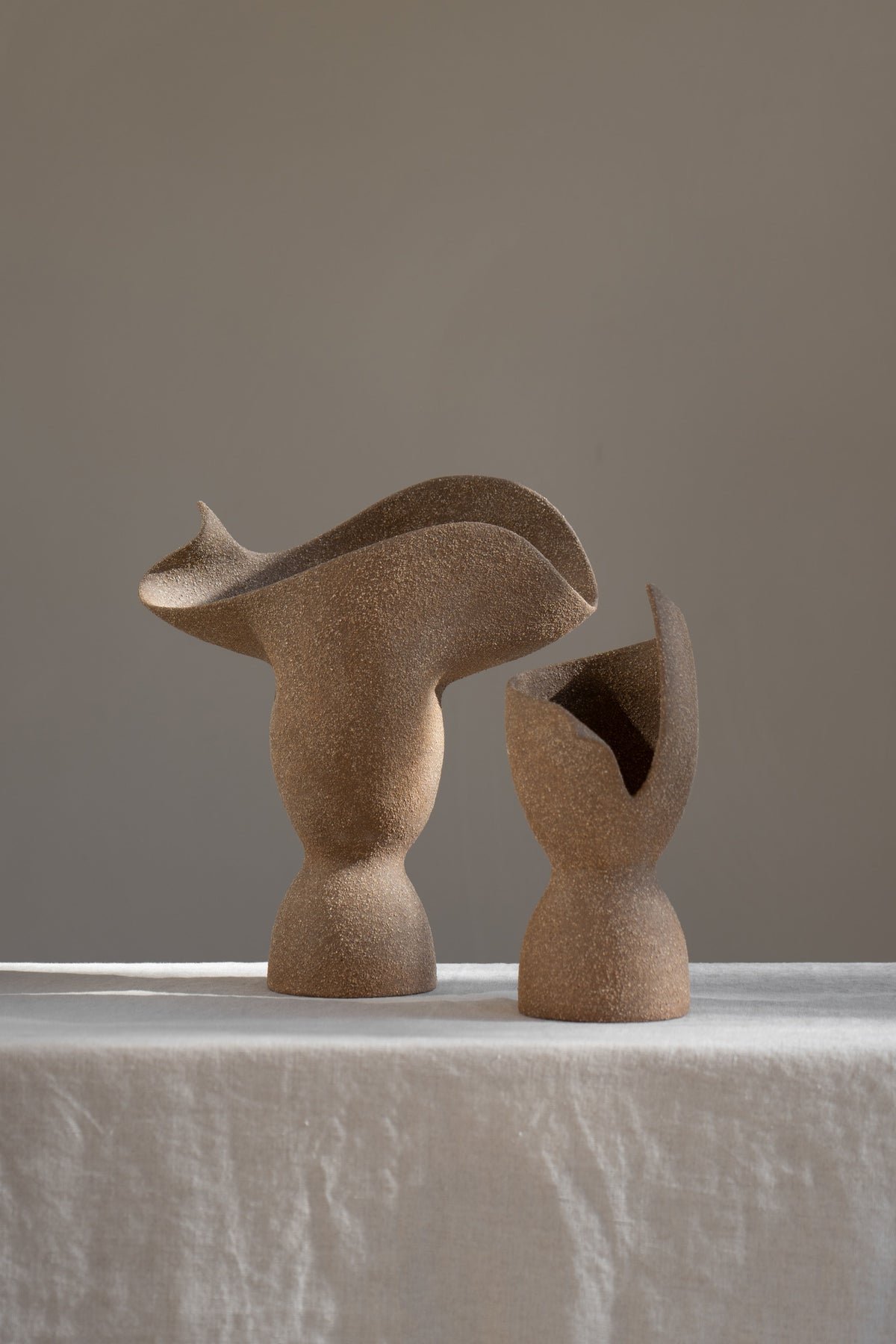 The Adorned Sculptural Vessel is a water-tight stoneware vase that can hold your favorite seasonal florals and branches.