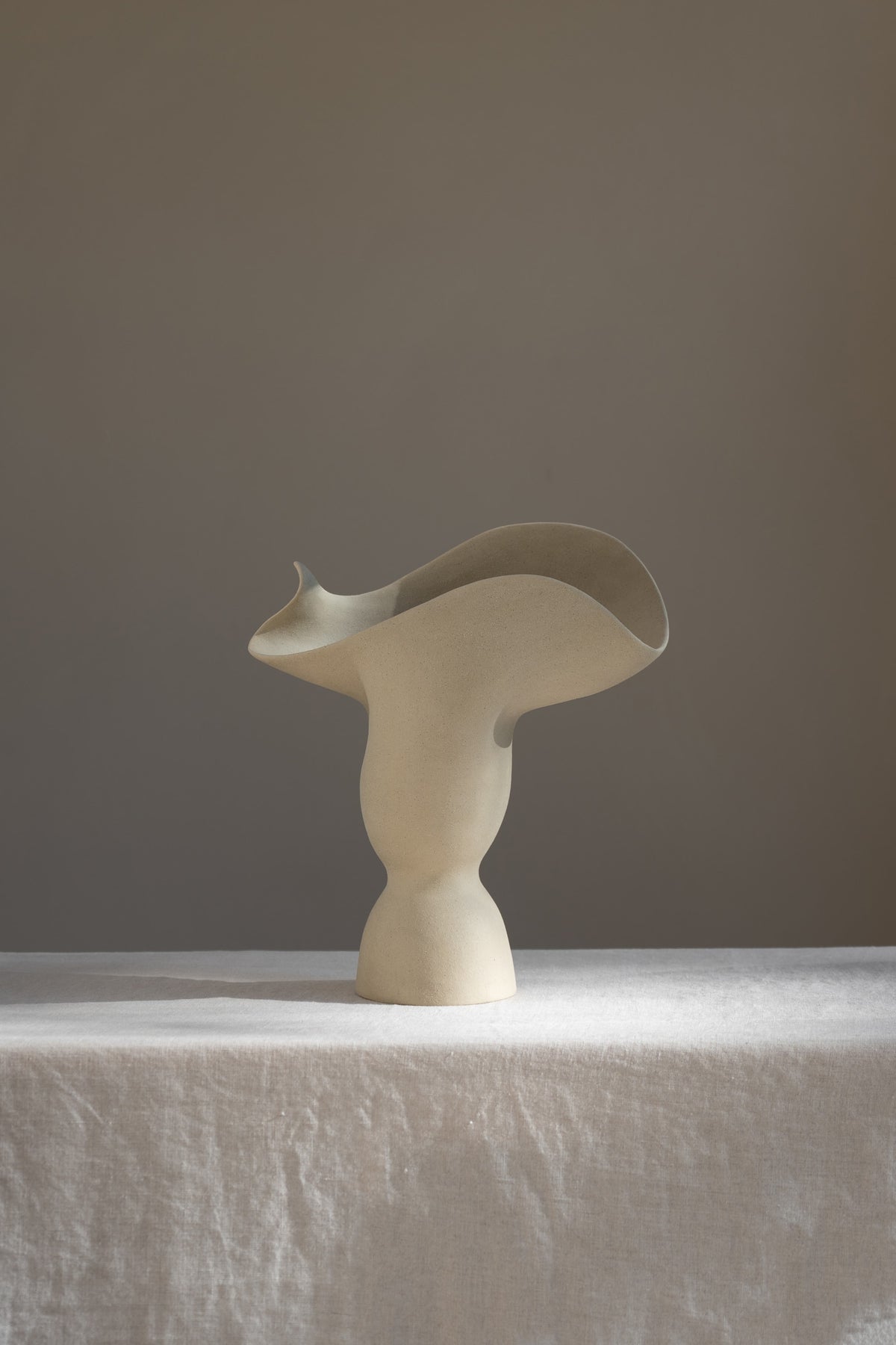 The Adorned Sculptural Vessel is a water-tight stoneware vase that can hold your favorite seasonal florals and branches.
