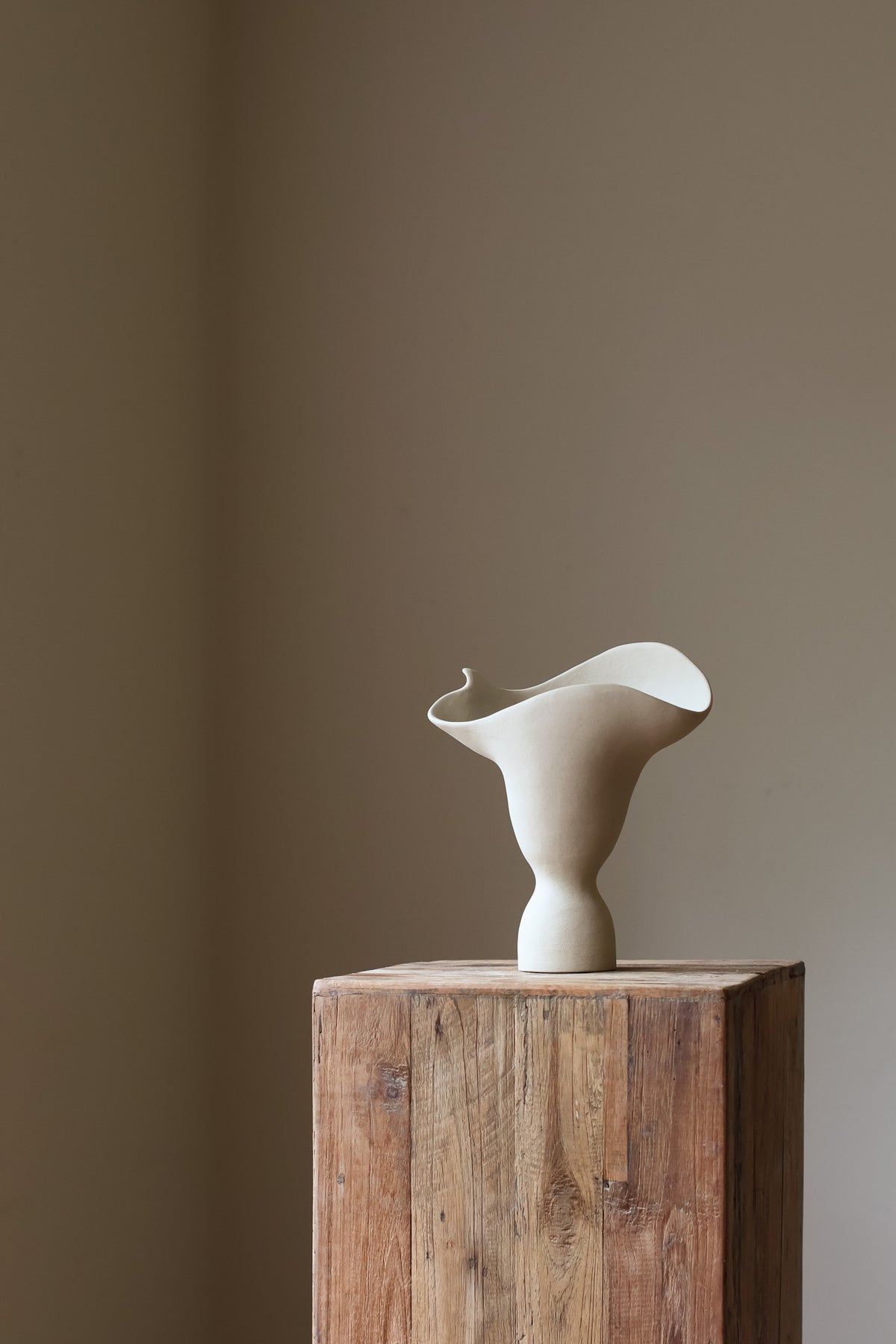 The Adorned Sculptural Vessel is a water-tight stoneware vase that can hold your favorite seasonal florals and branches.