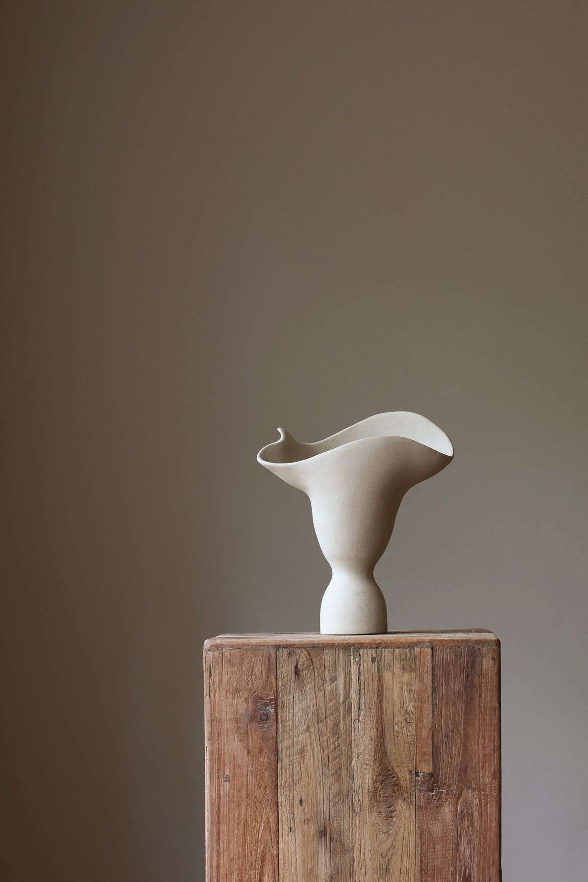 The Adorned Sculptural Vessel is a water-tight stoneware vase that can hold your favorite seasonal florals and branches.