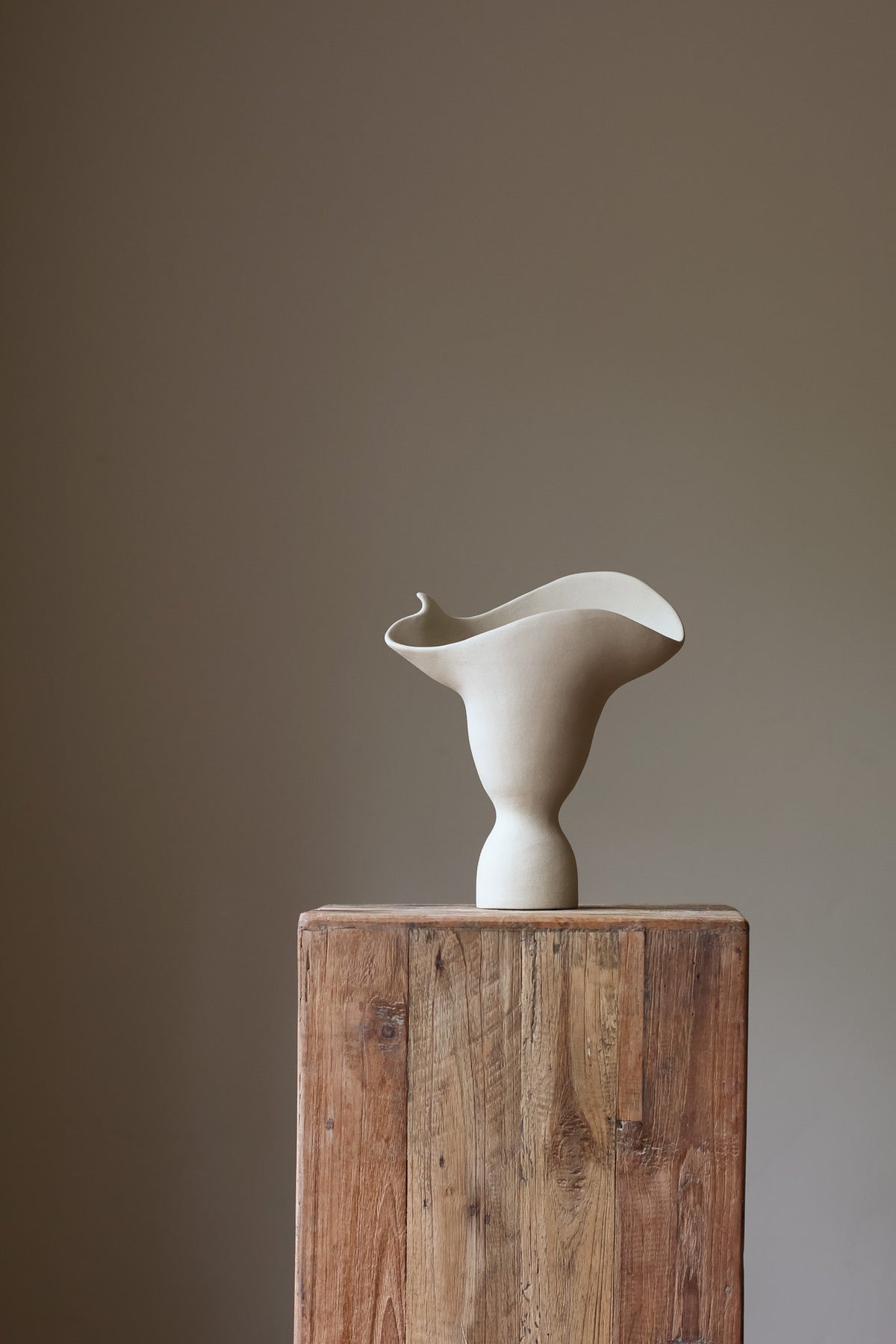 The Adorned Sculptural Vessel is a water-tight stoneware vase that can hold your favorite seasonal florals and branches.