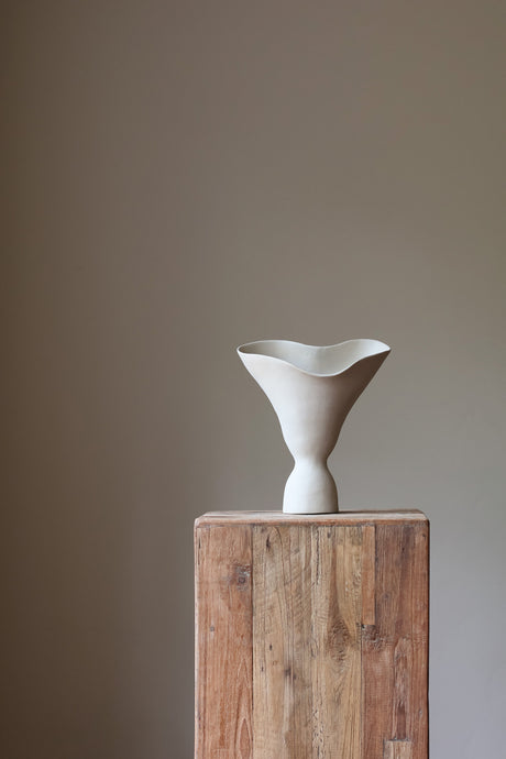The Aires Sculptural Vessel Taupe is a combination of fluid movement and structured form. 