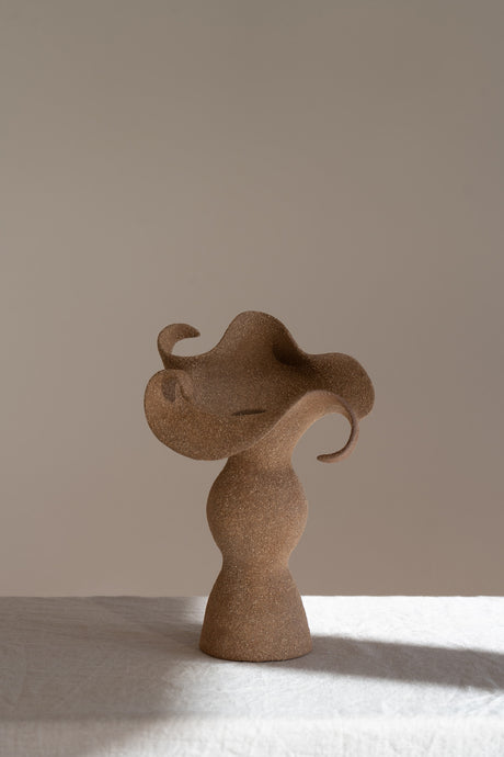 A beautifully crafted stoneware vase with curvaceous, organic outlines and soft brutalist forms. 