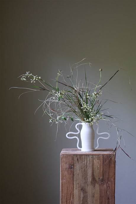 Beautiful and playful, the Curvy Amphora Vase is a piece of home art that will elevate the way you display florals and sculptural pieces in your living space.