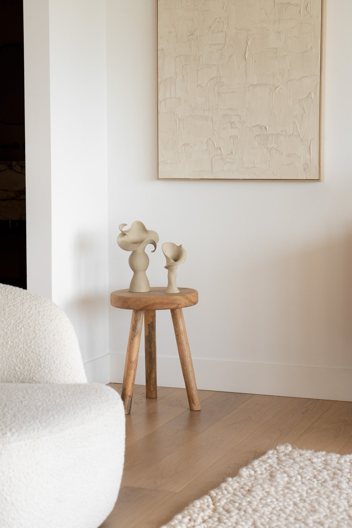 A matte taupe ceramic vase inspired by the Calla Lily, combining bold stoneware with soft floral curves. 