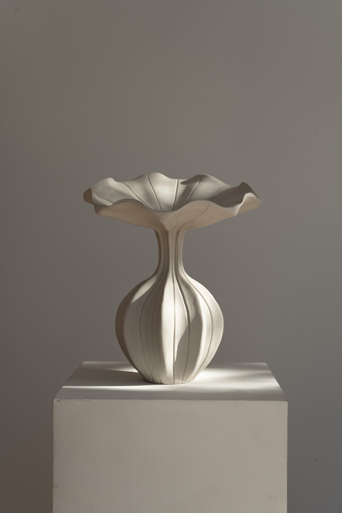 The Peplum Vessel, with its unique silhouette and contrasting form, creates an interesting focal point in your space.
