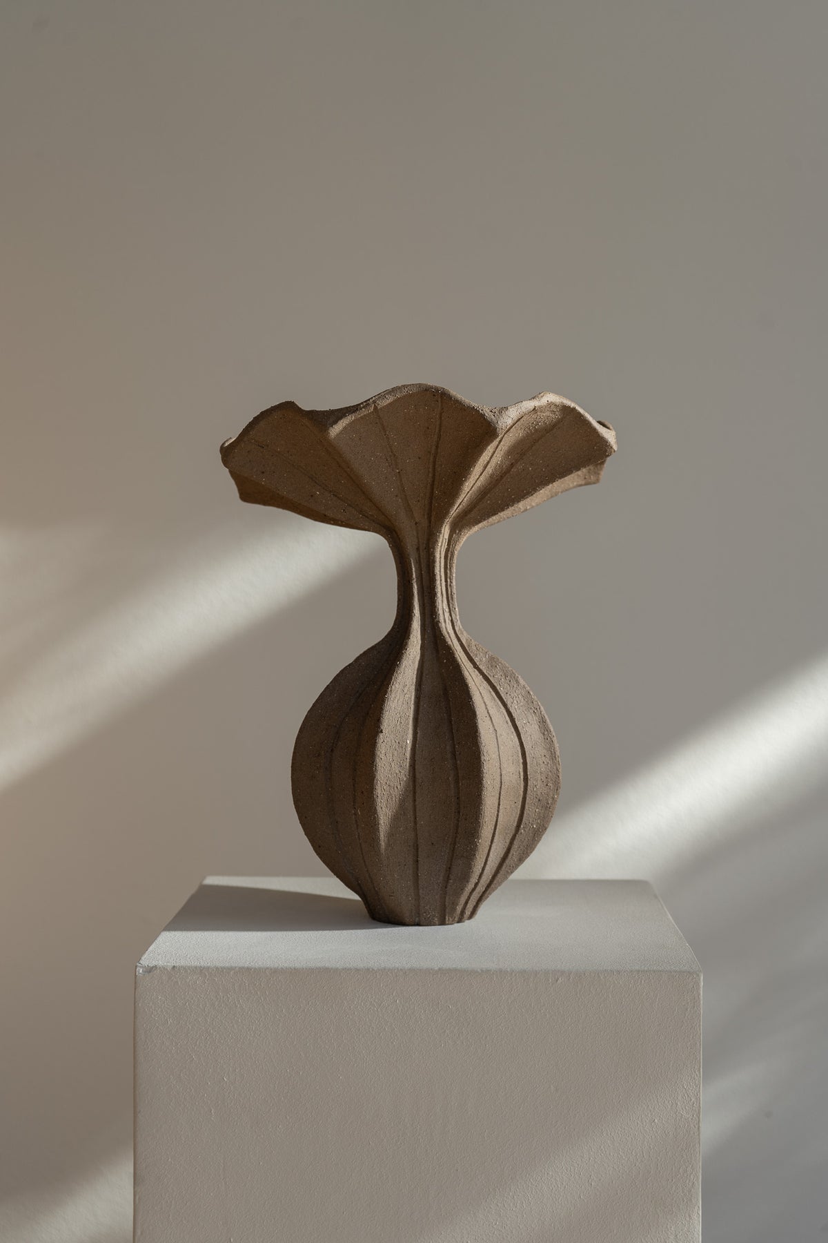The Peplum Vessel, with its unique silhouette and contrasting form, creates an interesting focal point in your space.