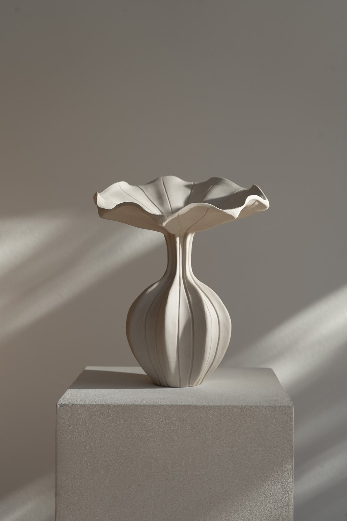 The Peplum Vessel, with its unique silhouette and contrasting form, creates an interesting focal point in your space.
