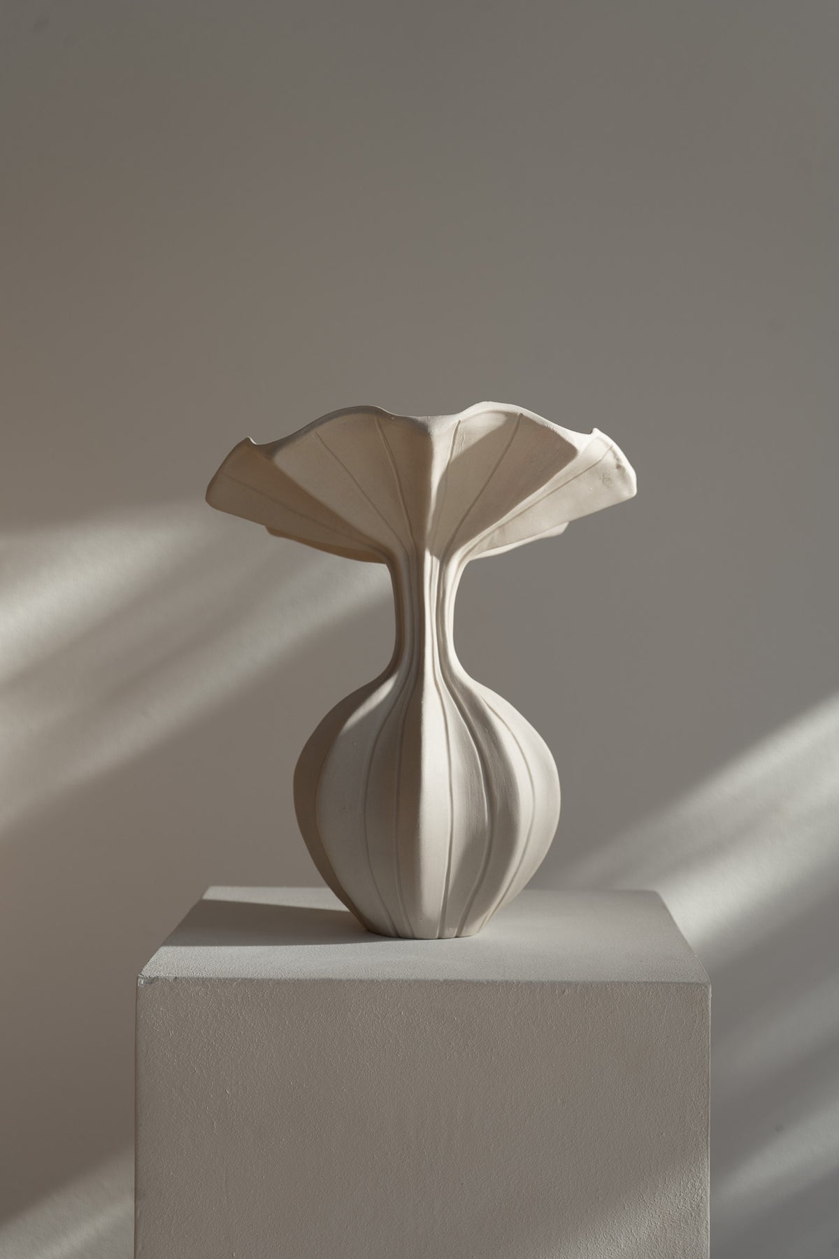 The Peplum Vessel, with its unique silhouette and contrasting form, creates an interesting focal point in your space.