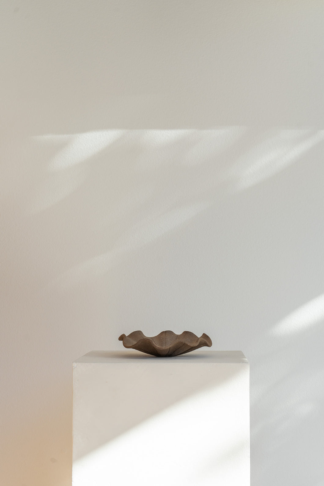 Handmade Low Ripple Tray by Jessica Eun Kyoung Choi, featuring an organic ripple design and raw texture. This versatile tray adds refined minimalism to any space, perfect for coffee tables, shelves, or book stacks