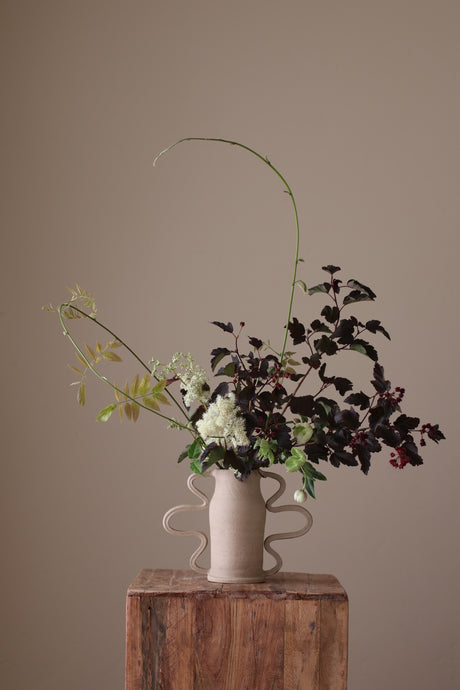 Curvy Amphora Vase in Dune by Kuu Pottery, featuring a unique, wheel-thrown design with bold, dynamic contours and handcrafted handles.