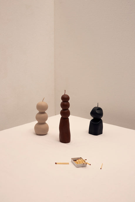 The Eclipse Sculptural Candle Set is a three-piece decorative candle set made from soy and paraffin wax, mixed with calming natural scents. 