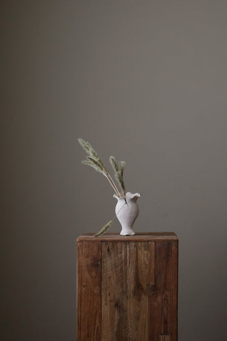 Blossoming Bud Vase in White Lava Glaze, Inspired by the tender rise of twin tulips from a single stem, this hand-built vase features two ruffled openings atop a shared base, each echoing the graceful unfurl of a bloom. 