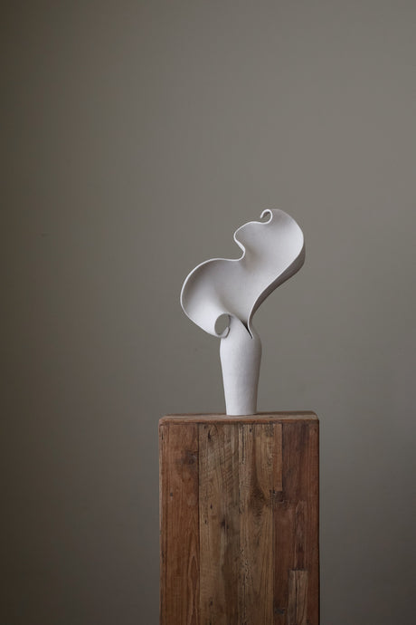 Scala Sculptural Vessel, Contemporary ceramic art vase with elegant abstract form and fluid sculptural curves, featuring a matte white speckled finish