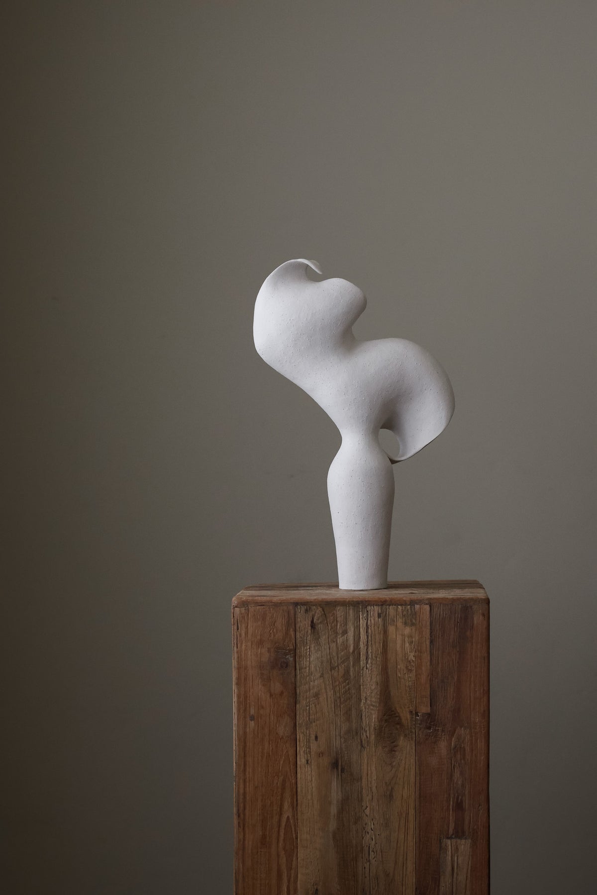 Scala Sculptural Vessel, Contemporary ceramic art vase with elegant abstract form and fluid sculptural curves, featuring a matte white speckled finish