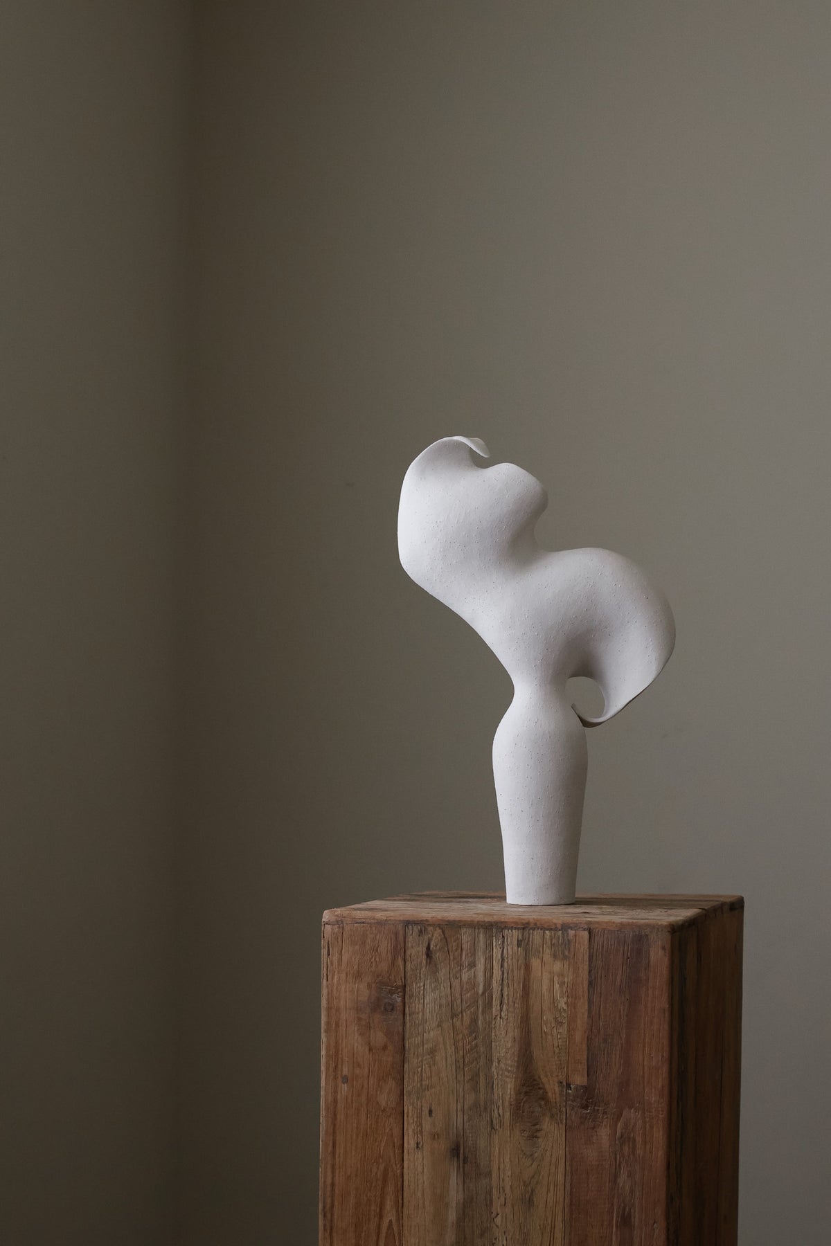 Scala Sculptural Vessel, Contemporary ceramic art vase with elegant abstract form and fluid sculptural curves, featuring a matte white speckled finish
