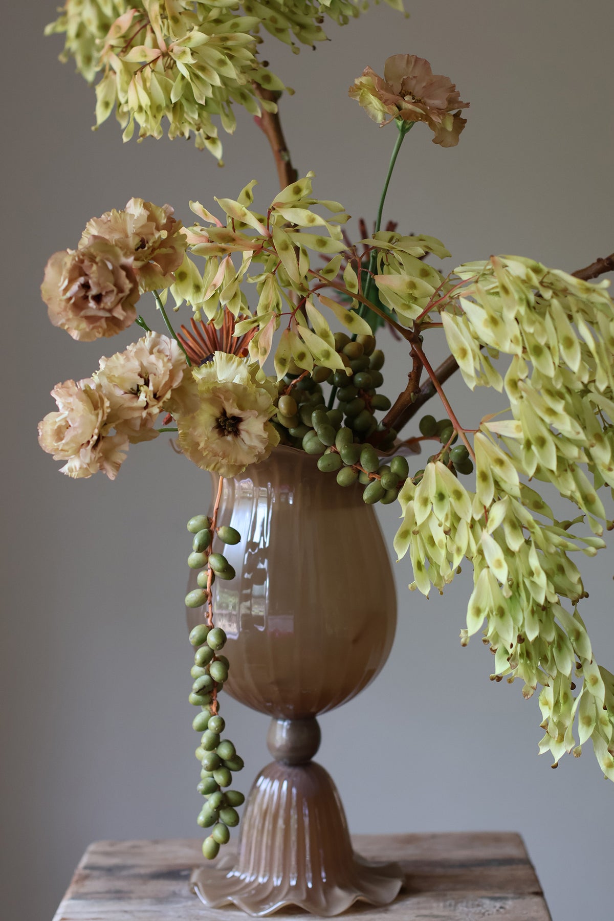 Opulent Glass Vessel Sepia, tulip-inspired design with elegant ruffles, adding sophistication and timeless beauty to modern interiors. Perfect for floral arrangements, this sculptural piece blends nature and art for a stunning home decor accent