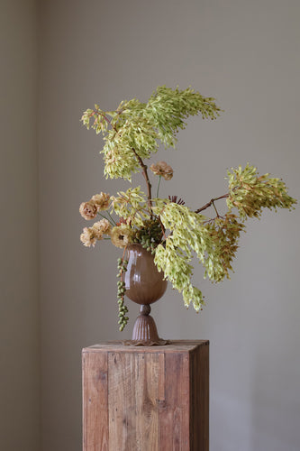 Opulent Glass Vessel Sepia, tulip-inspired design with elegant ruffles, adding sophistication and timeless beauty to modern interiors. Perfect for floral arrangements, this sculptural piece blends nature and art for a stunning home decor accent
