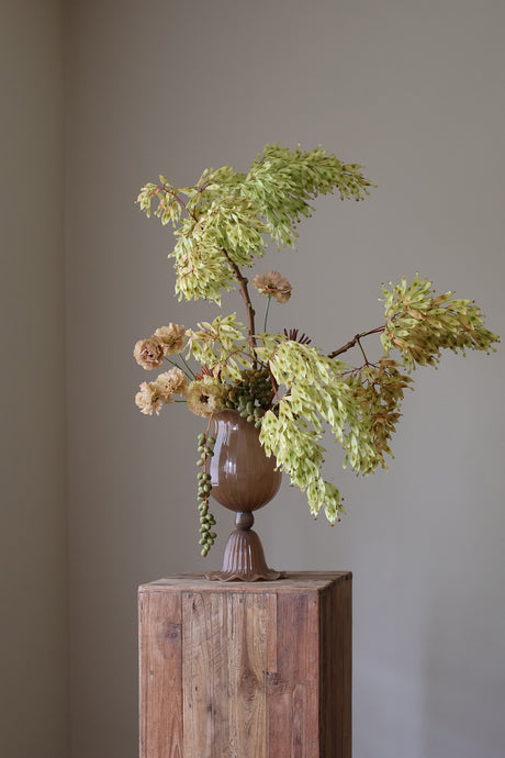 Opulent Glass Vessel Sepia, tulip-inspired design with elegant ruffles, adding sophistication and timeless beauty to modern interiors. Perfect for floral arrangements, this sculptural piece blends nature and art for a stunning home decor accent