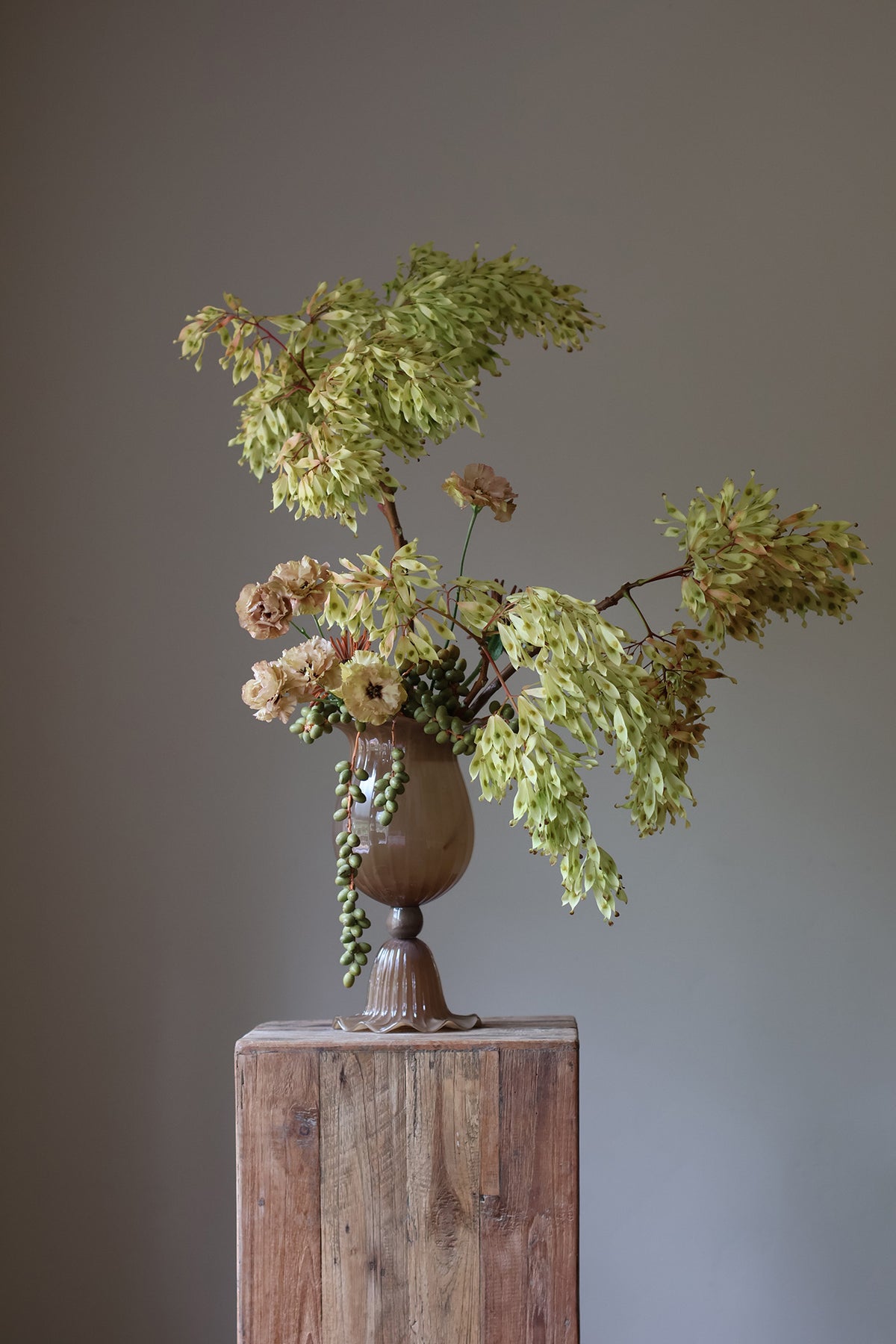 Opulent Glass Vessel Sepia, tulip-inspired design with elegant ruffles, adding sophistication and timeless beauty to modern interiors. Perfect for floral arrangements, this sculptural piece blends nature and art for a stunning home decor accent