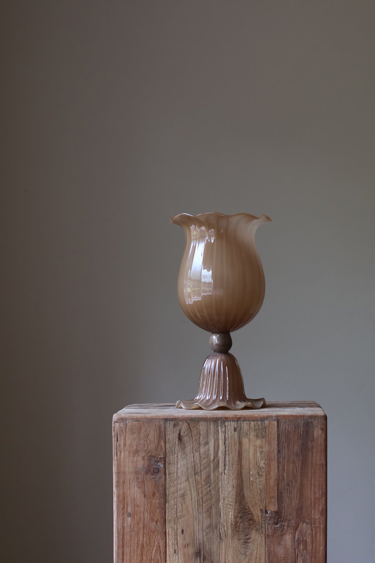 Opulent Glass Vessel Sepia, tulip-inspired design with elegant ruffles, adding sophistication and timeless beauty to modern interiors. Perfect for floral arrangements, this sculptural piece blends nature and art for a stunning home decor accent
