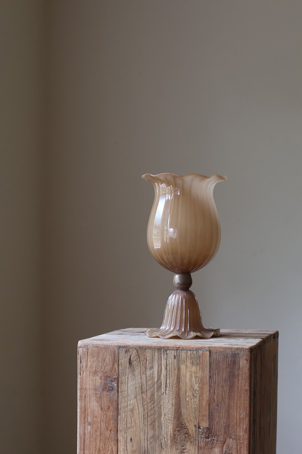 Opulent Glass Vessel Sepia, tulip-inspired design with elegant ruffles, adding sophistication and timeless beauty to modern interiors. Perfect for floral arrangements, this sculptural piece blends nature and art for a stunning home decor accent