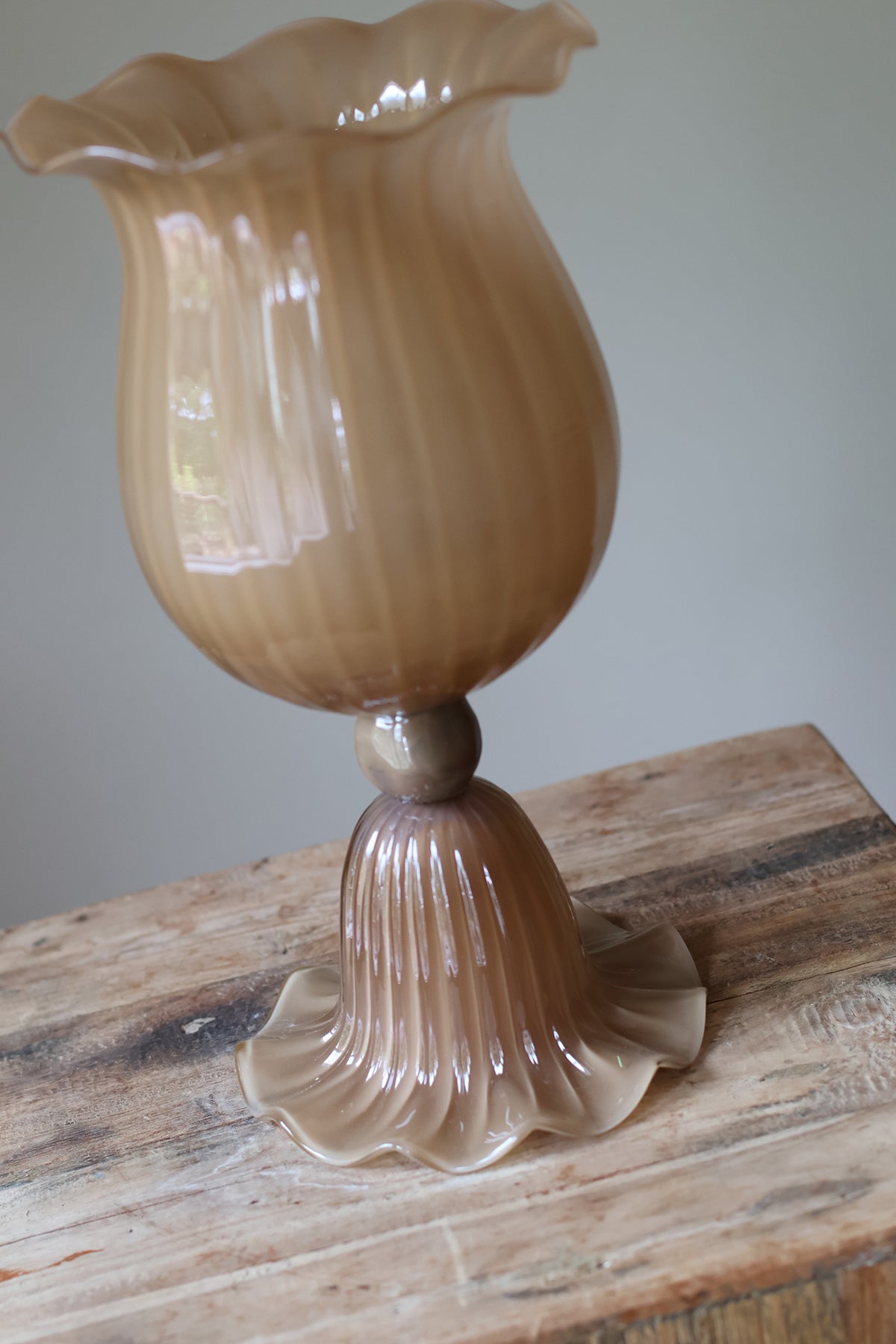 Opulent Glass Vessel Sepia, tulip-inspired design with elegant ruffles, adding sophistication and timeless beauty to modern interiors. Perfect for floral arrangements, this sculptural piece blends nature and art for a stunning home decor accent