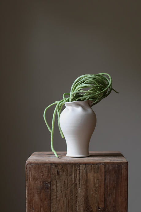 Introducing the Helix Vase, a stunning fusion of contemporary and traditional design. 