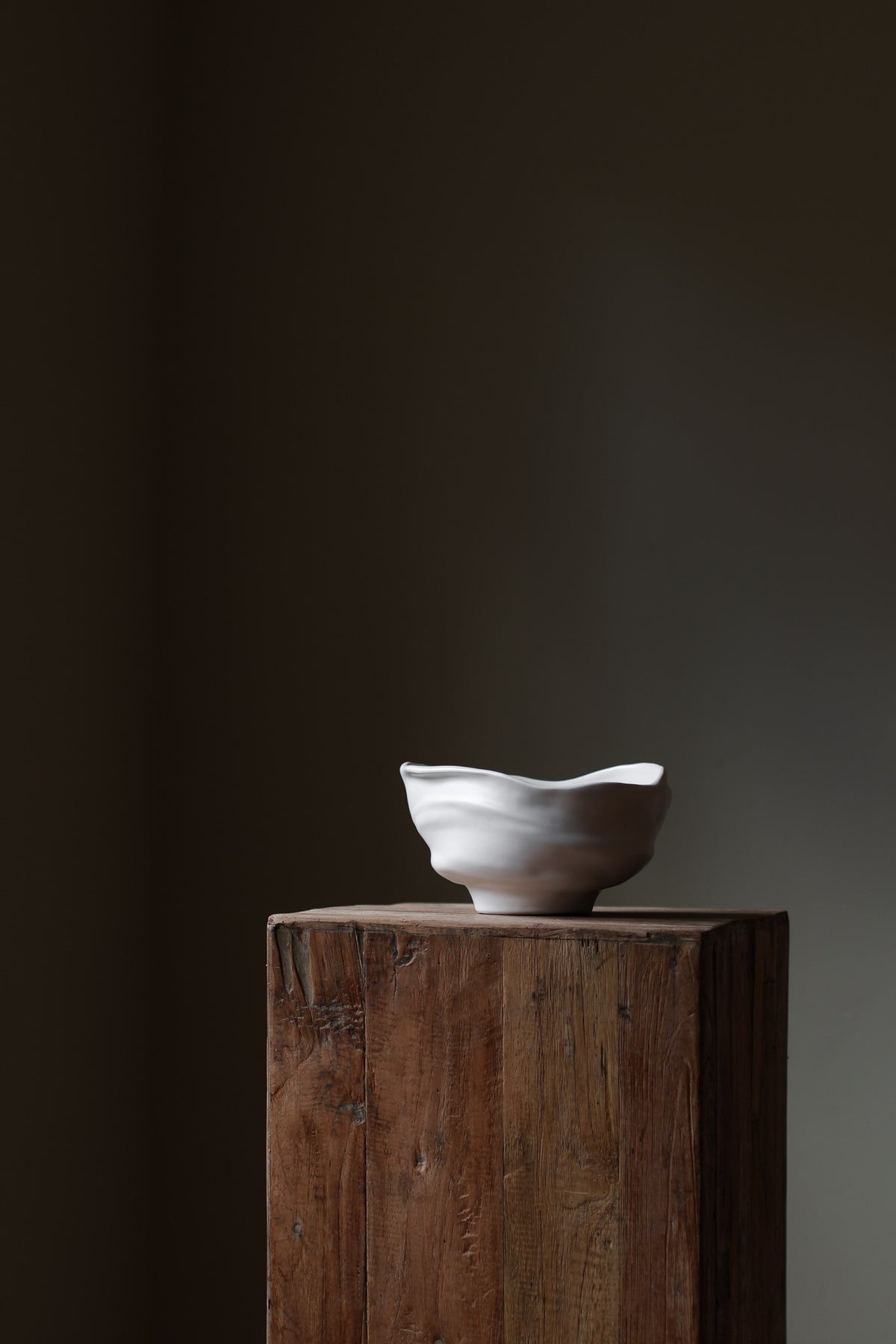 Handmade porcelain bowl with satin glaze, unique surface variations, perfect for kitchen, coffee table, or living room styling.