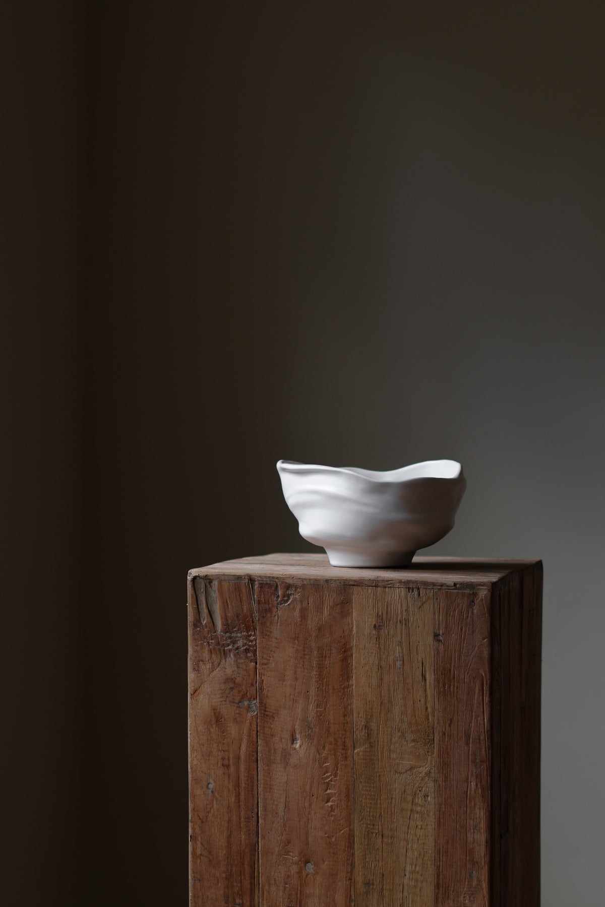 Handmade porcelain bowl with satin glaze, unique surface variations, perfect for kitchen, coffee table, or living room styling.