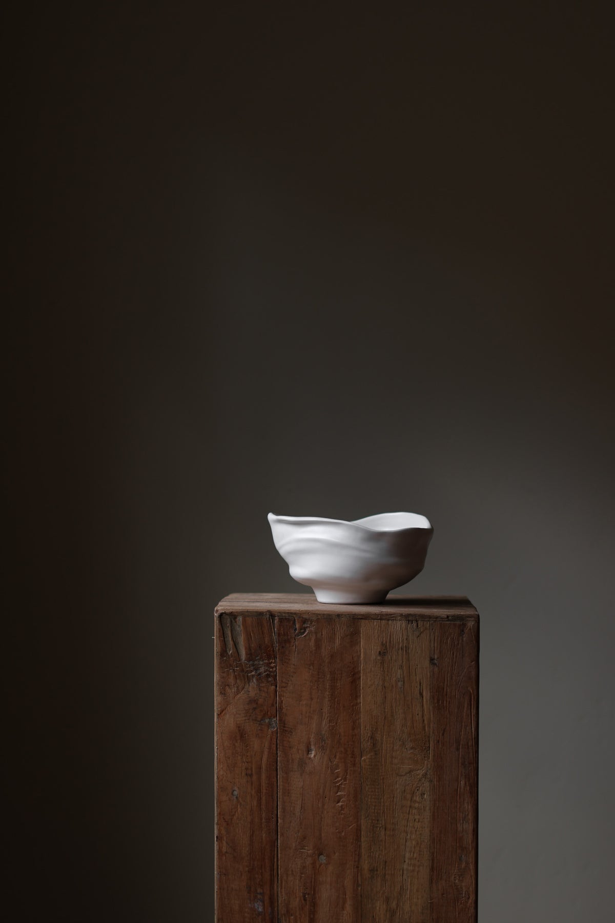 Handmade porcelain bowl with satin glaze, unique surface variations, perfect for kitchen, coffee table, or living room styling.