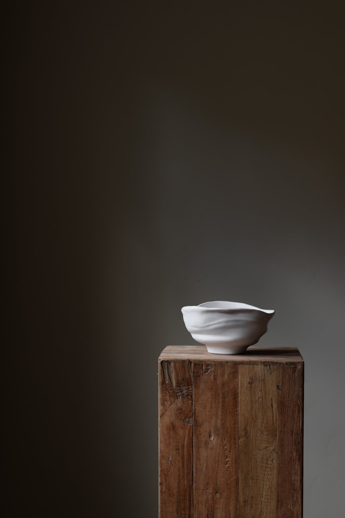 Handmade porcelain bowl with satin glaze, unique surface variations, perfect for kitchen, coffee table, or living room styling.