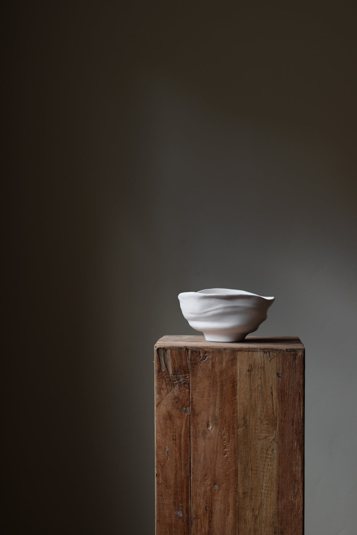 Handmade porcelain bowl with satin glaze, unique surface variations, perfect for kitchen, coffee table, or living room styling.