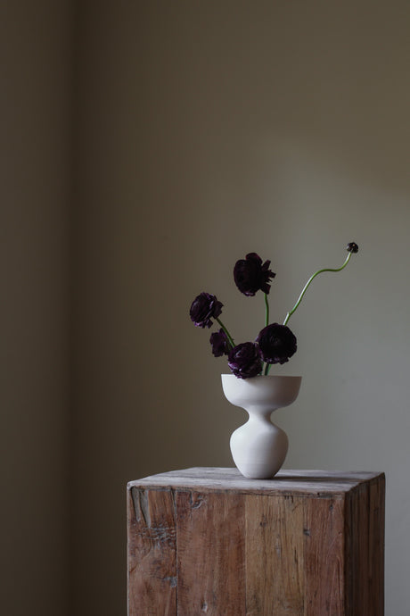 Minimalist off-white Hourglass Porcelain Vase small, wide shallow bowl atop slender hourglass-shaped base, perfect sculptural decor accent.