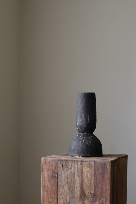 Hand-built black ceramic vase by Giselle Hicks, featuring a heavily textured surface and a distinctive, sculptural form.