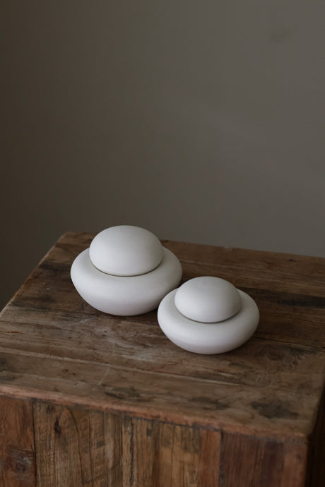 Crafted with a textured surface inspired by natural stone formations, Stone Jars are ideal for storing small items or serving as a striking statement piece.