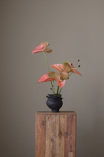  The vase showcases delicate and intricate ruffled layers of dark ceramic, creating a sense of graceful movement. The texture of the ceramic is subtle and tactile. Handcrafted by Bay Area artist Virginia May, this piece reflects the artful collection that captures layers of subtle texture. 