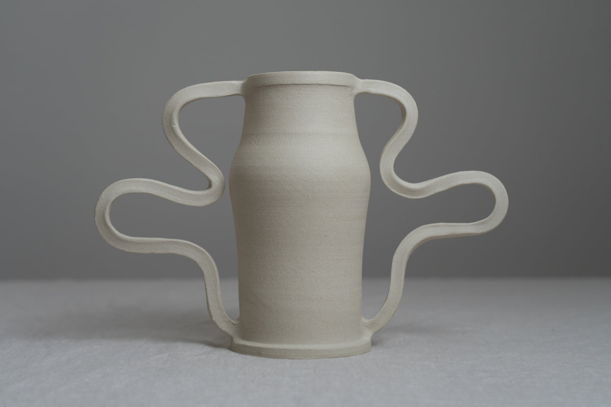 Beautiful and playful, the Curvy Amphora Vase is a piece of home art that will elevate the way you display florals and sculptural pieces in your living space. 