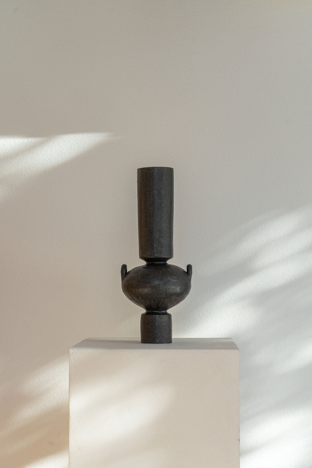 Handmade ceramic Isolated N.23 Ink vessel, black glaze and textured surface, inspired by Mediterranean artifacts.