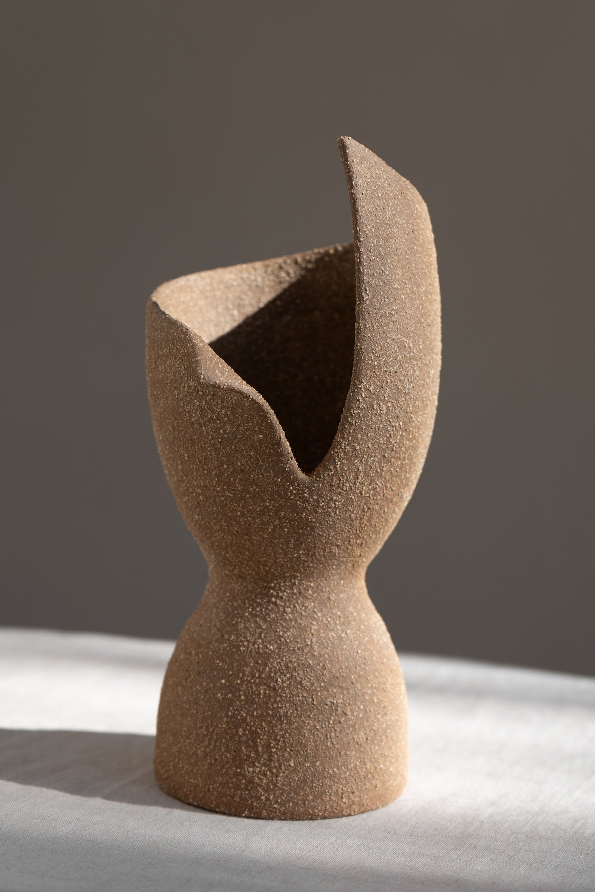 A captivating product of brutalist architecture and romantic homeware design, the Laetus Sculptural Vessel is a masterpiece that belongs in your home decor collection.