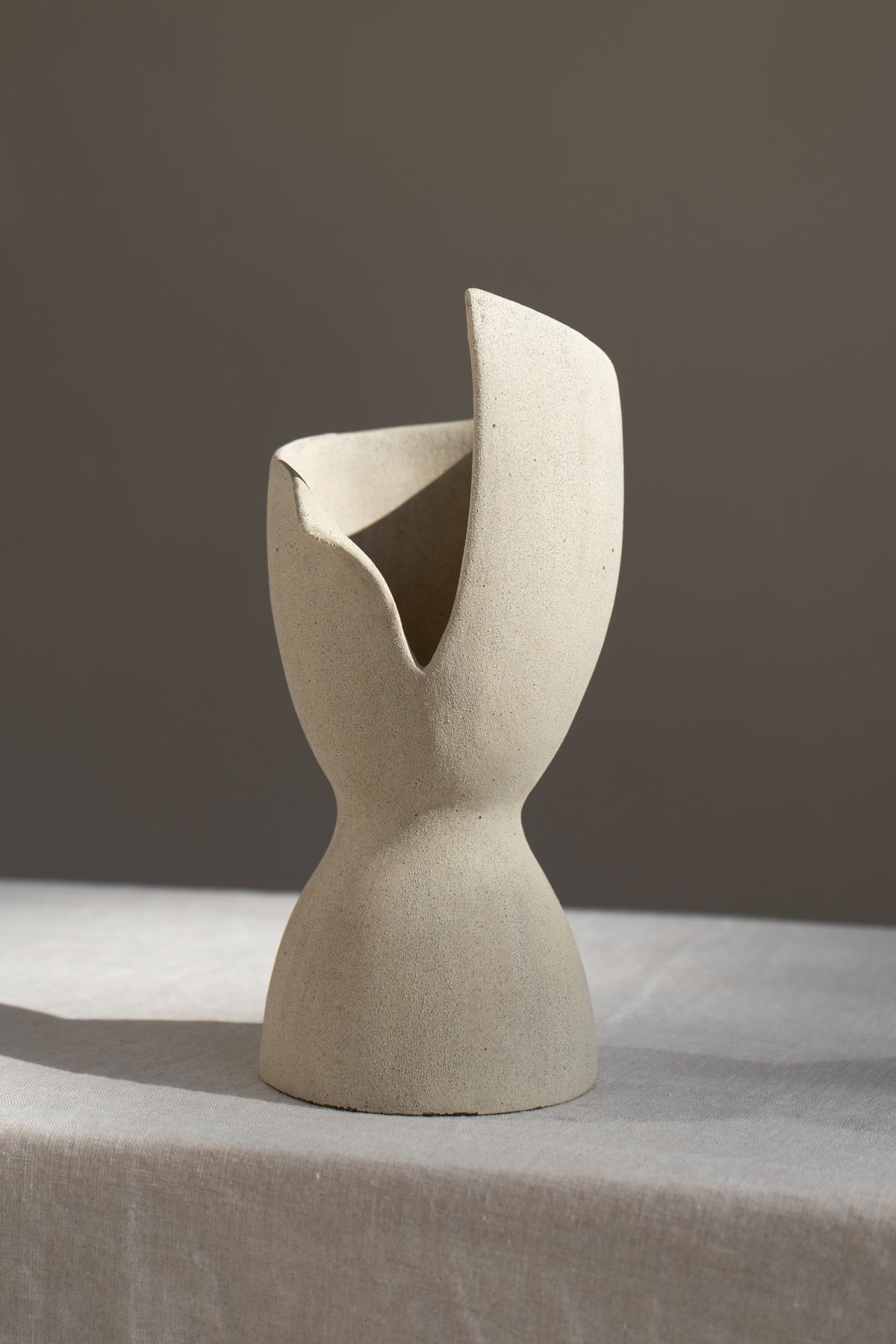 A captivating product of brutalist architecture and romantic homeware design, the Laetus Sculptural Vessel is a masterpiece that belongs in your home decor collection.