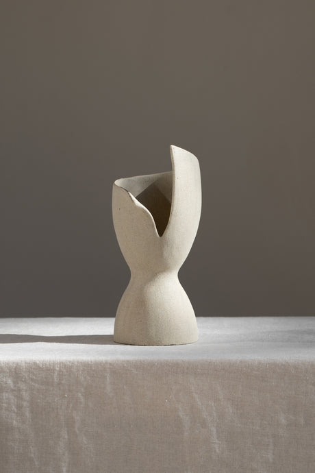 A captivating product of brutalist architecture and romantic homeware design, the Laetus Sculptural Vessel is a masterpiece that belongs in your home decor collection.