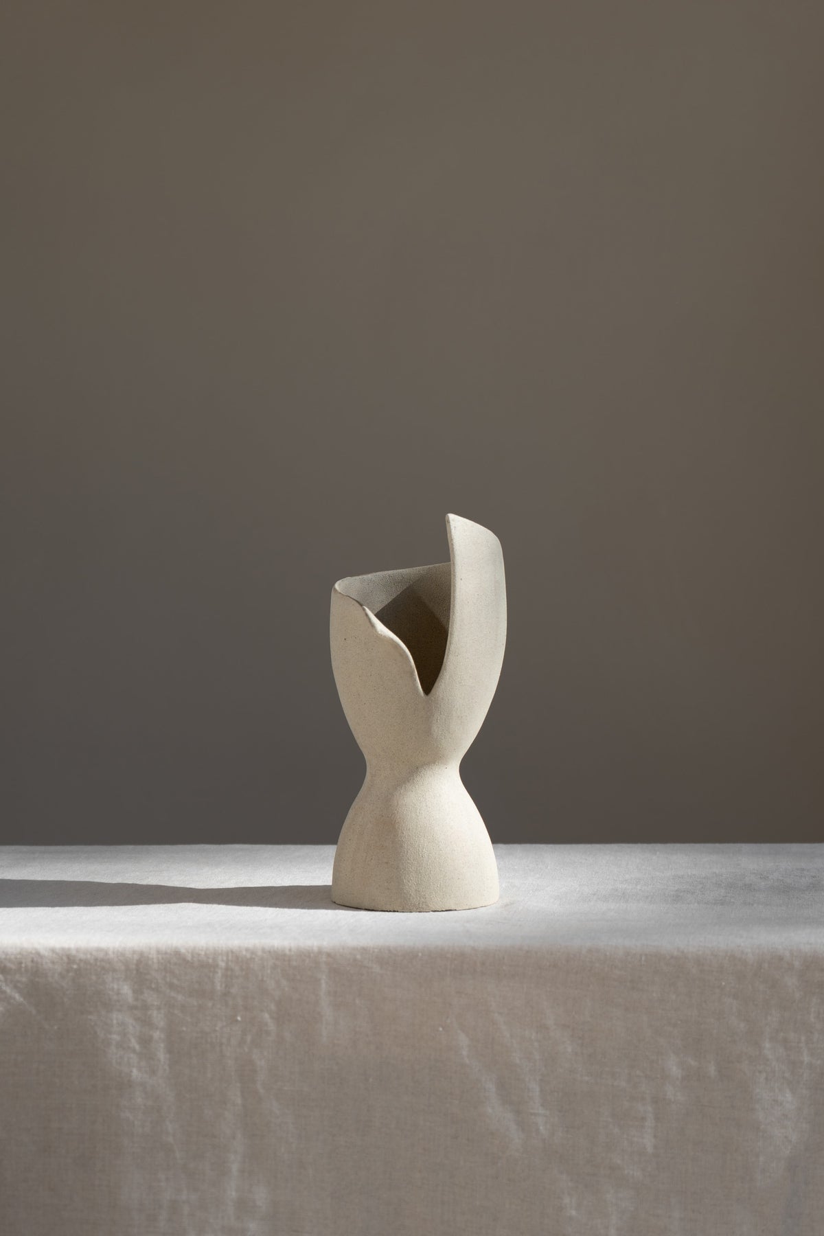 A captivating product of brutalist architecture and romantic homeware design, the Laetus Sculptural Vessel is a masterpiece that belongs in your home decor collection.