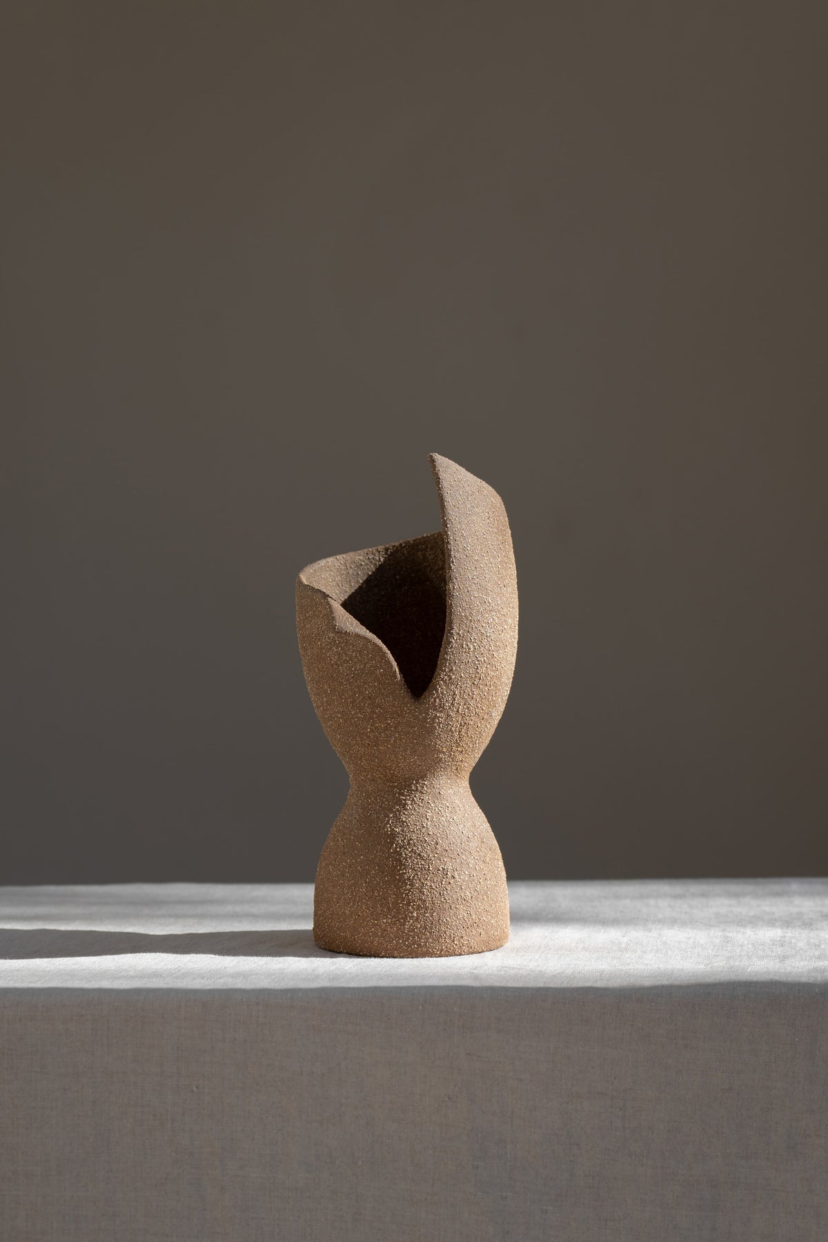 A captivating product of brutalist architecture and romantic homeware design, the Laetus Sculptural Vessel is a masterpiece that belongs in your home decor collection.
