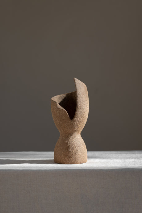 A captivating product of brutalist architecture and romantic homeware design, the Laetus Sculptural Vessel is a masterpiece that belongs in your home decor collection.
