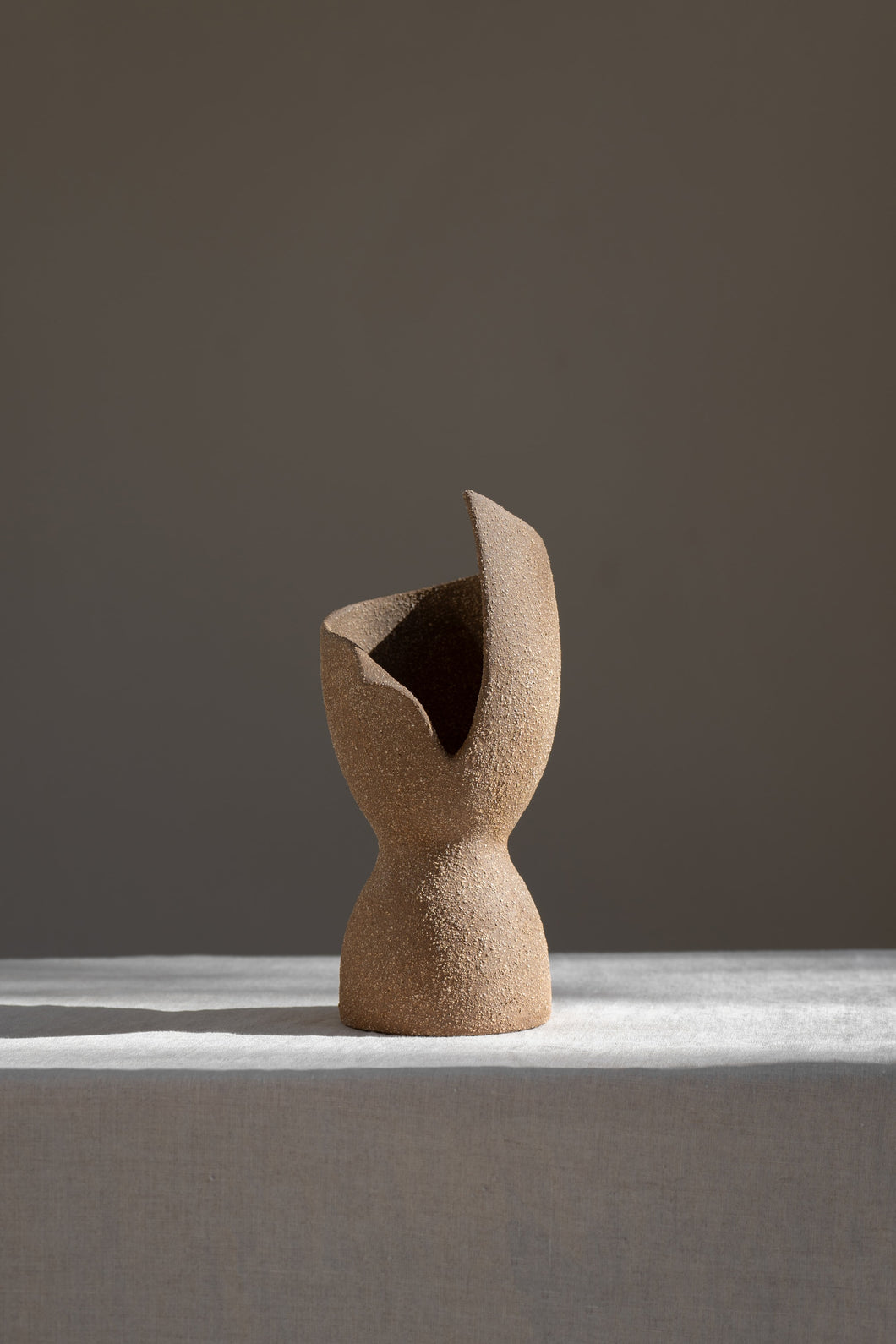 A captivating product of brutalist architecture and romantic homeware design, the Laetus Sculptural Vessel is a masterpiece that belongs in your home decor collection.